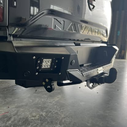 Nissan Navara fitted with a rear replacement bumper and LED work lights