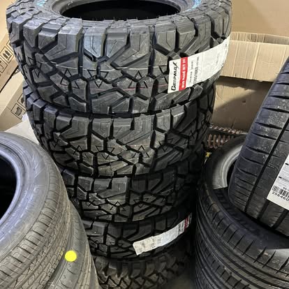 Aggressive Gripmax Mud Terrain tyres staged up for fitment