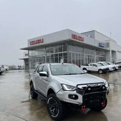Isuzu D-Max on all-terrains with bull bar and recovery points