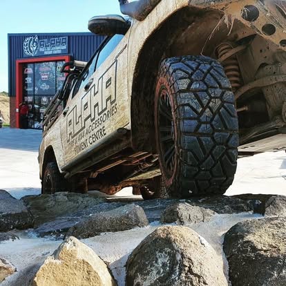 The Alpha bakkie flexing over the rock course at the workshop