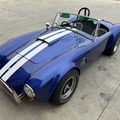 Blue AC Cobra replica in for wheels and tyres