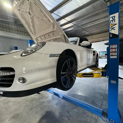 Porsche 911 Turbo Cabriolet up on the two-post lift