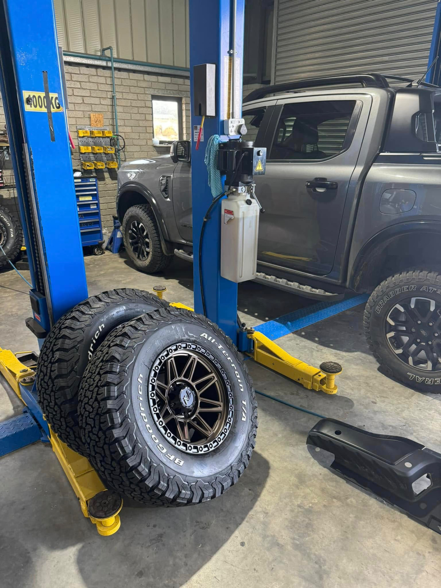 Ford Ranger on the two-post lift ready for a fresh set of BFGoodrich All-Terrain tyres